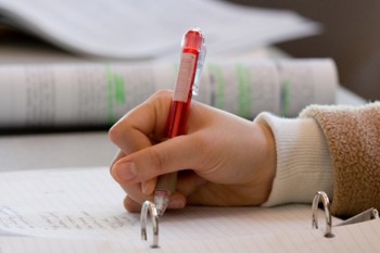 student writing notes
