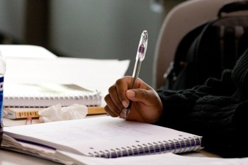 student writing notes